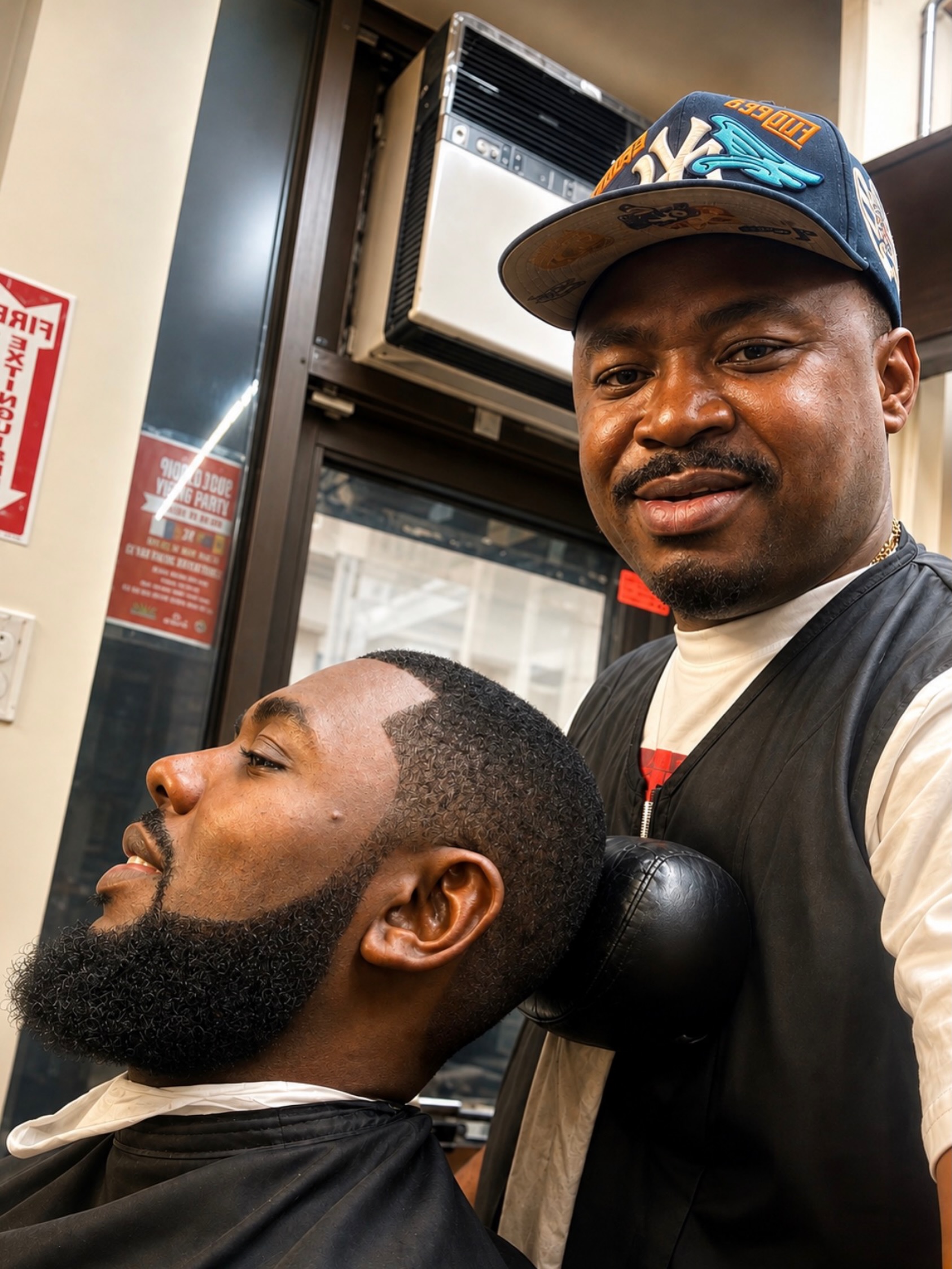 Barber selfie with client showing a fresh cut and beard at Ro Barbershop, Harlem NYC