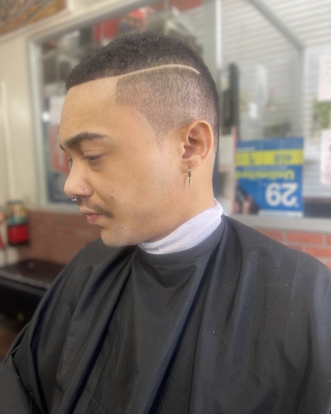 Fade haircut with razor design at Ro Barbershop Harlem