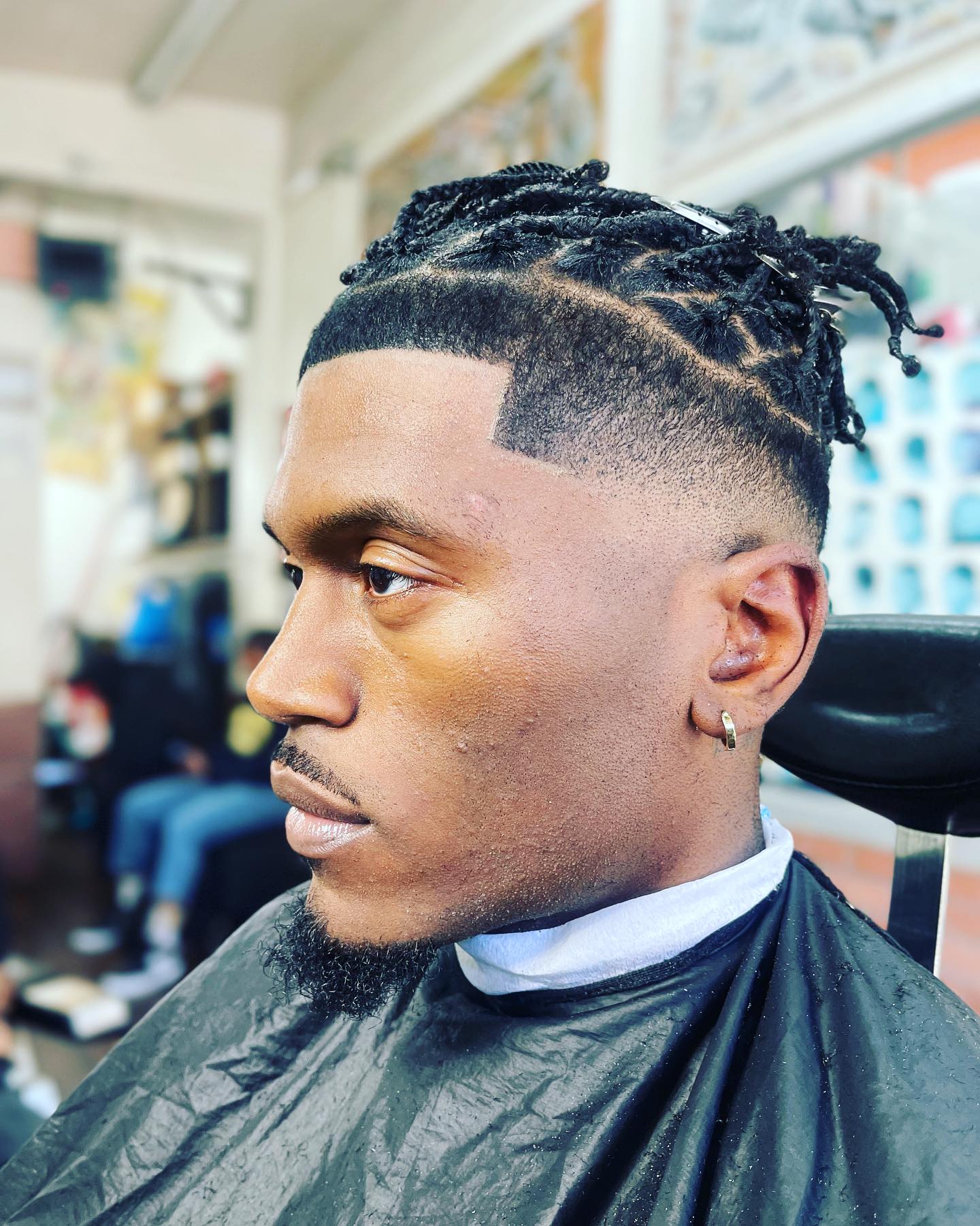Sharp line-up and twists haircut at Ro Barbershop