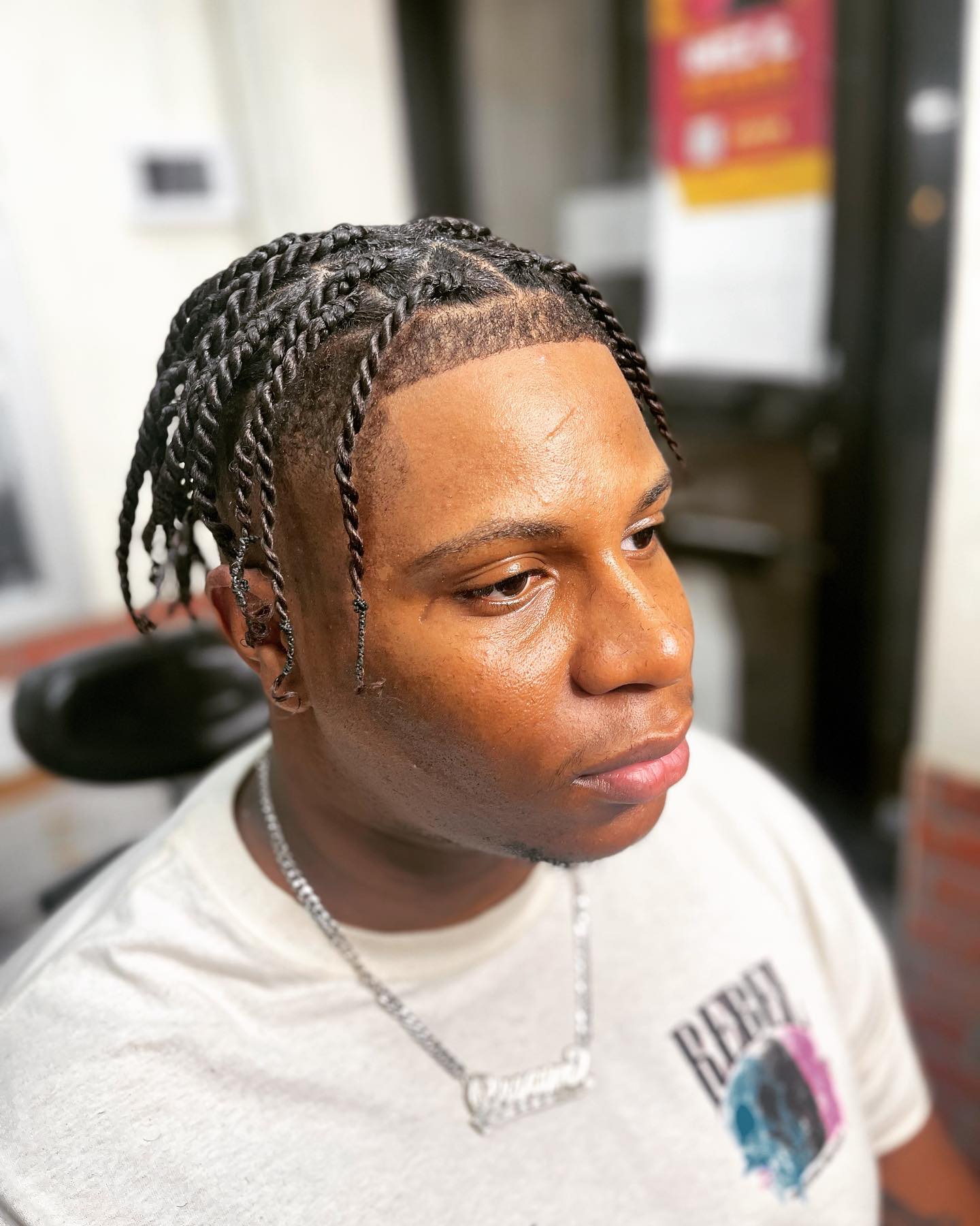 Braids with sharp line-up at Ro Barbershop, Harlem NYC