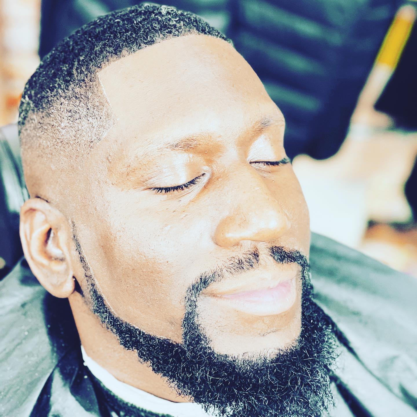 Close-up of a sharp line-up and beard trim at Ro Barbershop